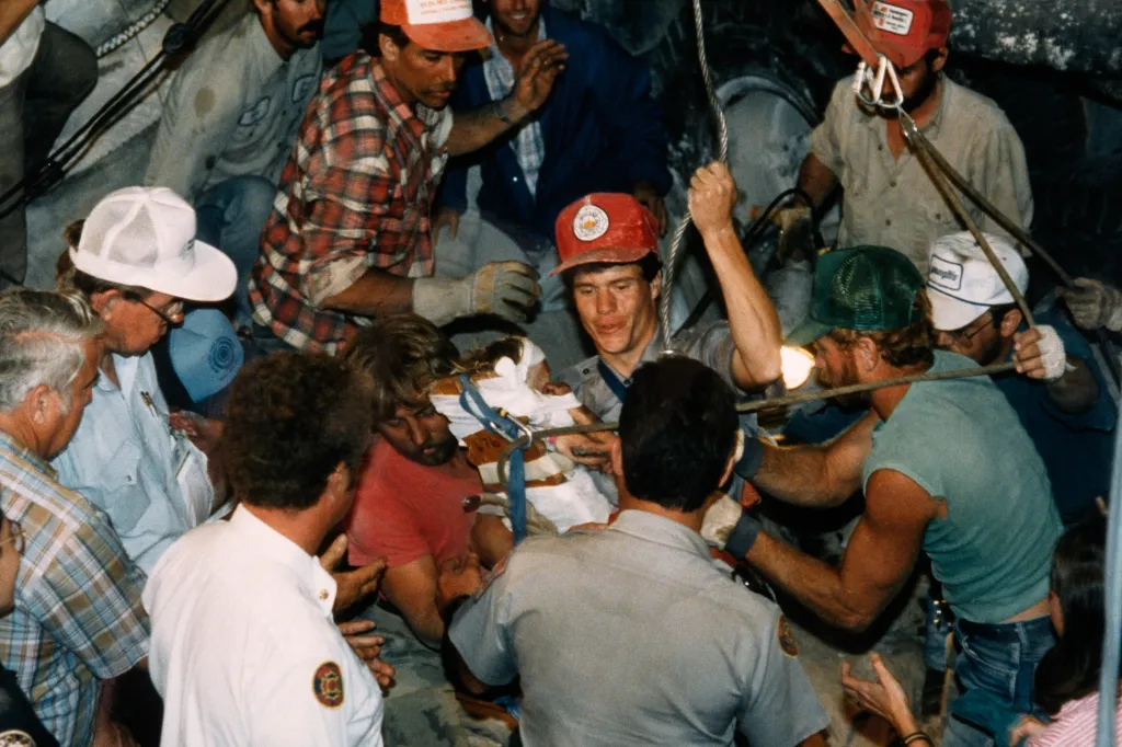 Rescuers work to free Jessica McClure from a water well.