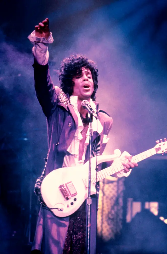 Prince performing on stage during the Purple Rain Tour.