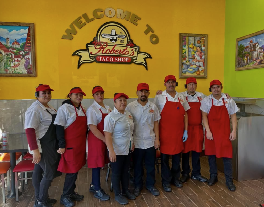 Staff of Roberto's Taco Shop posing for a picture.