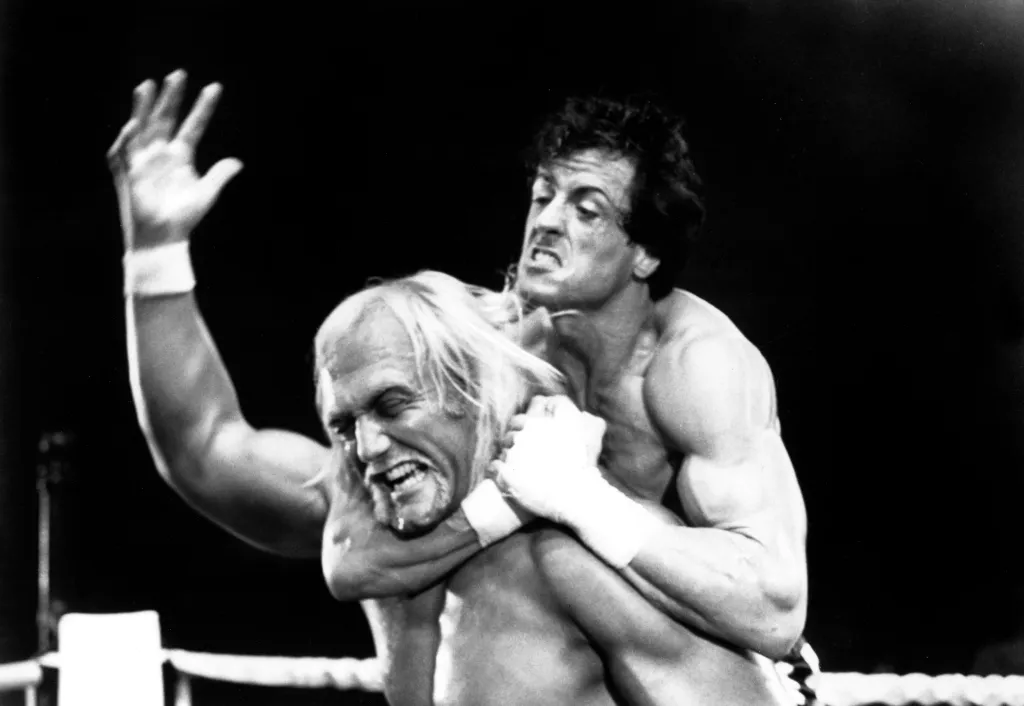 Sylvester Stallone applying a choke hold to Hulk Hogan in Rocky III