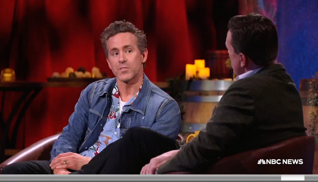 Ryan Reynolds talking to an interviewer.