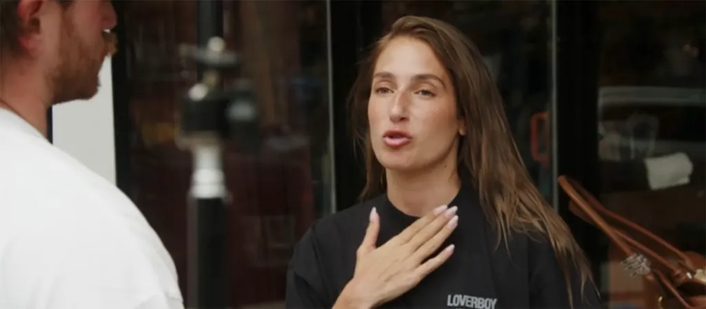 Amanda Batula speaking with her hand on her chest.