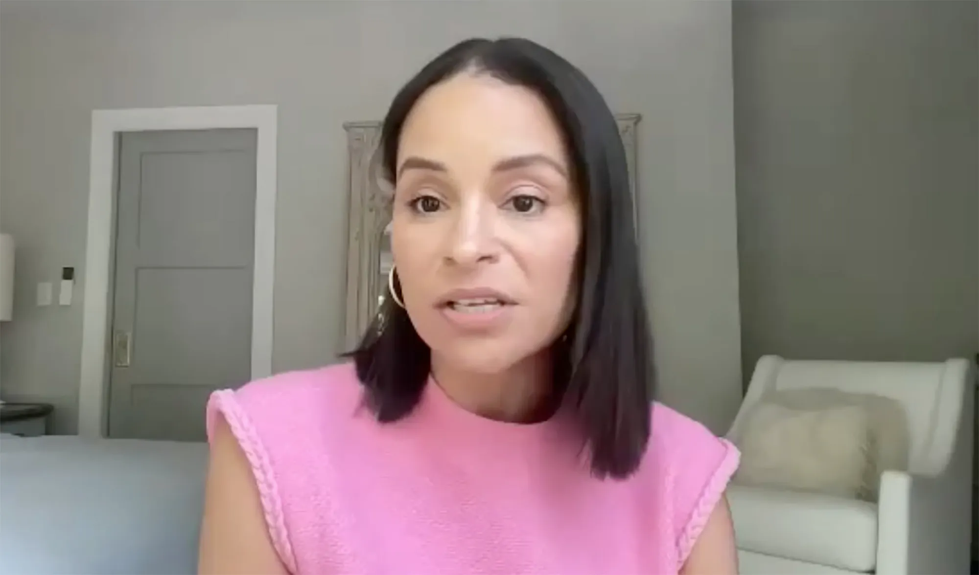 Sai de Silva in a pink top, speaking during a Page Six interview.