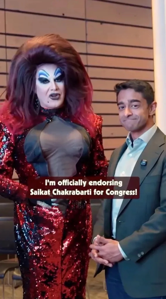 Drag queen in red sequined outfit endorsing Saikat Chakrabarti for Congress.