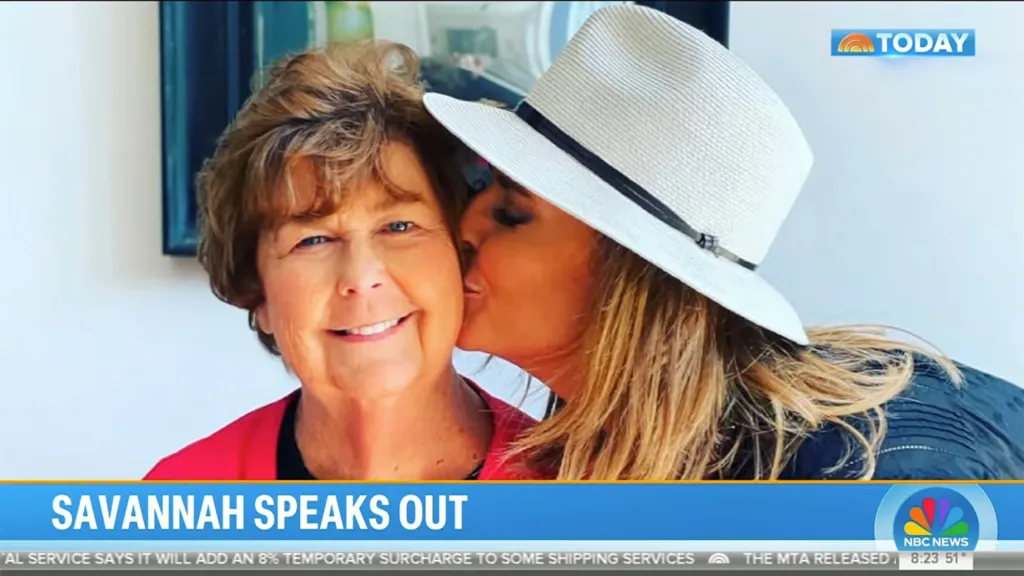 Savannah Guthrie kissing an older woman on the cheek.