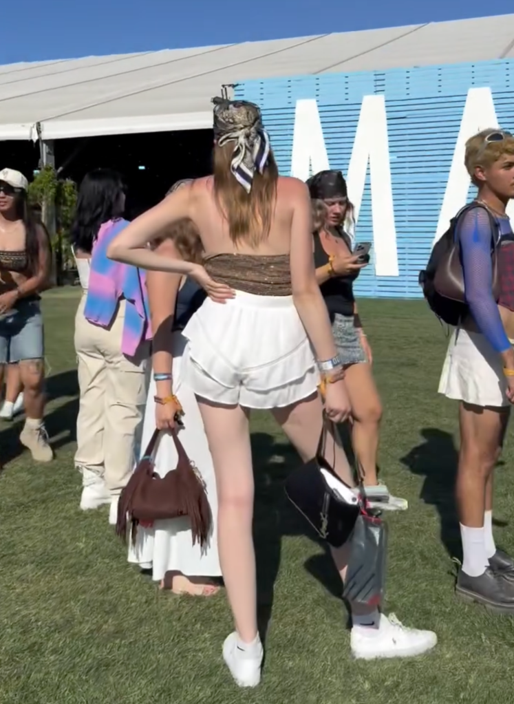 A group of festivalgoers waiting in line at Coachella.