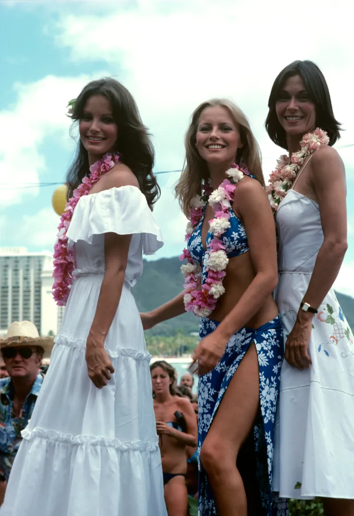 Jaclyn Smith, Cheryl Ladd, and Kate Jackson from Charlie's Angels wearing leis in Hawaii.