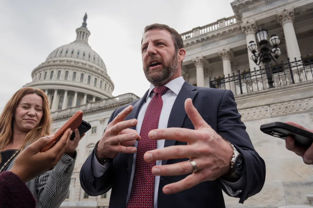 Senator Markwayne Mullin speaking to reporters outside the Capitol building.