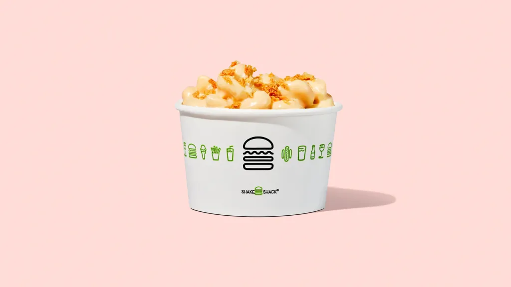 Shake Shack Smoky BBQ Mac & Cheese in a white Shake Shack branded cup.