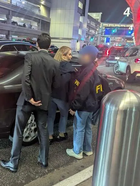 Shamim Mafi being arrested at Los Angeles International Airport for trafficking arms for the government of Iran.