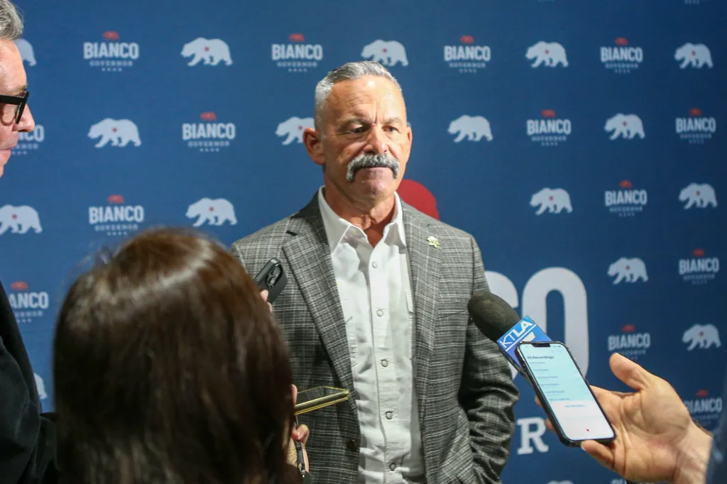 Sheriff Chad Bianco speaks at a press conference with 