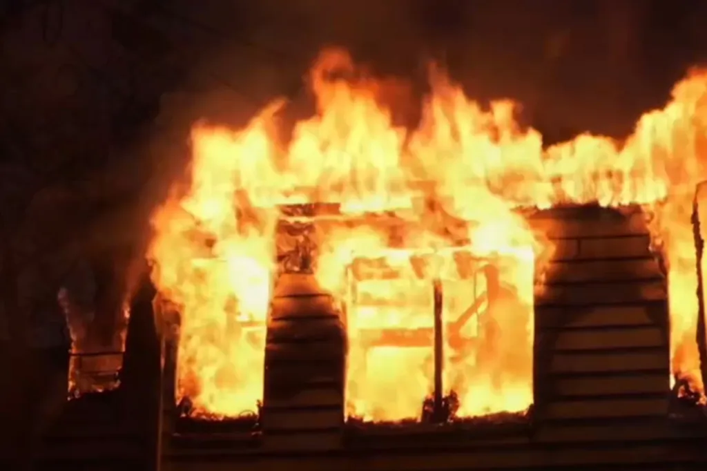 A building engulfed in massive flames.