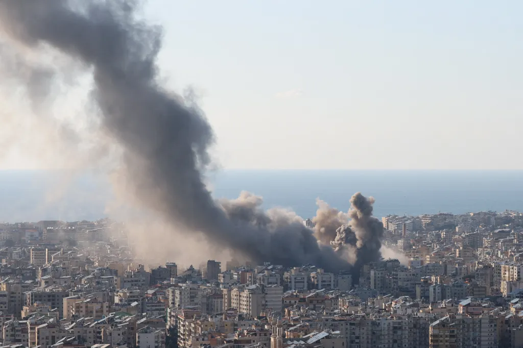 Smoke and dust rise over Beirut's southern suburbs after an Israeli strike.
