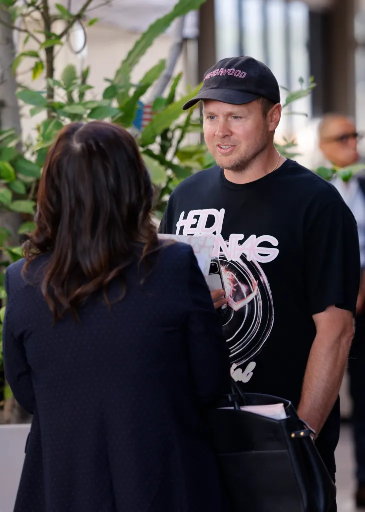 Spencer Pratt talking to a woman while filing his Declaration of Intention to become a candidate for LA Mayor.
