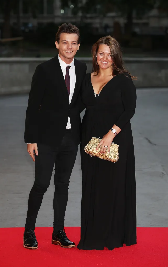 Louis Tomlinson and Johannah Poulston pose at the Believe in Magic Cinderella Ball.