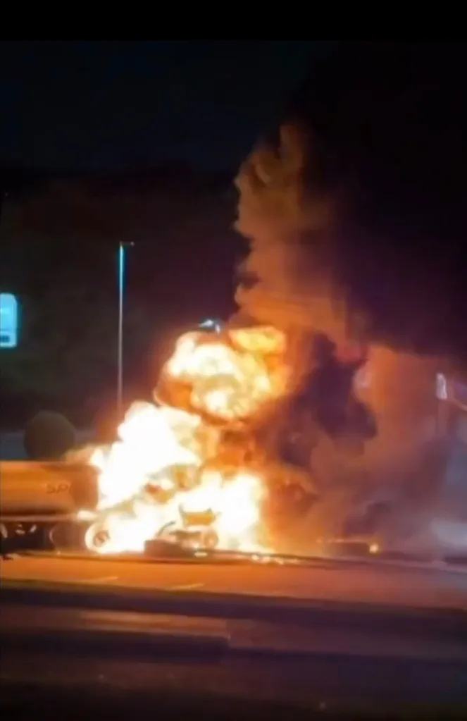 The driver was hospitalized with burns, but no one else was injured