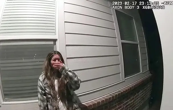Taylor Frankie Paul covering her mouth, captured on a bodycam.
