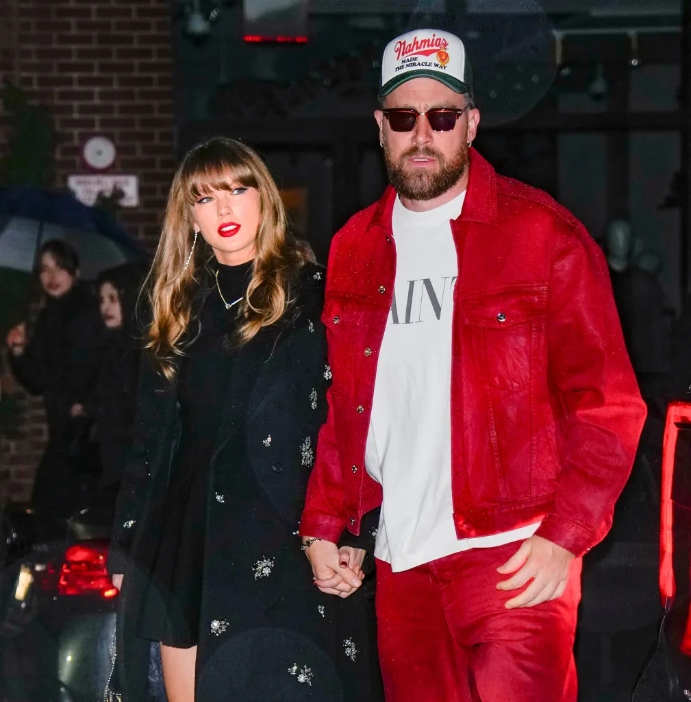Taylor Swift and Travis Kelce walking hand-in-hand in New York City.