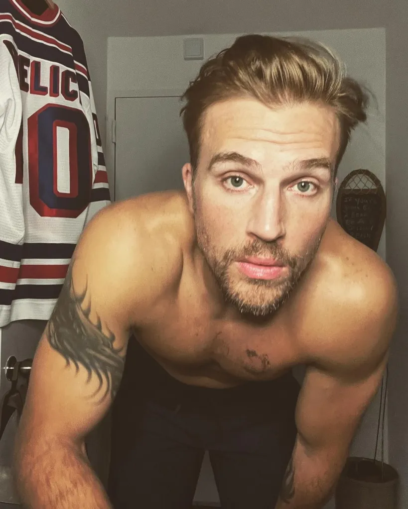 Summer House star Luke Gulbranson, shirtless and leaning forward.