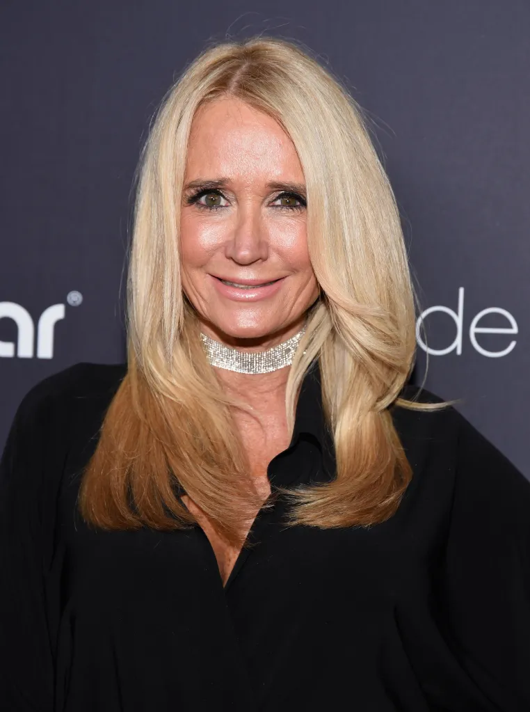Television personality Kim Richards smiling at an event.