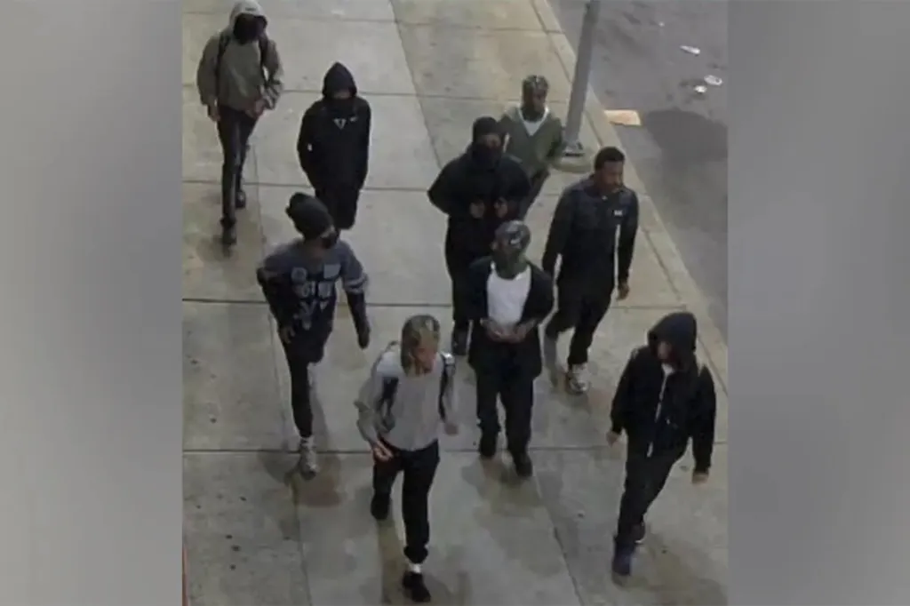 A group of at least nine teens chased down a Temple college student into his dorm hall and attacked him.