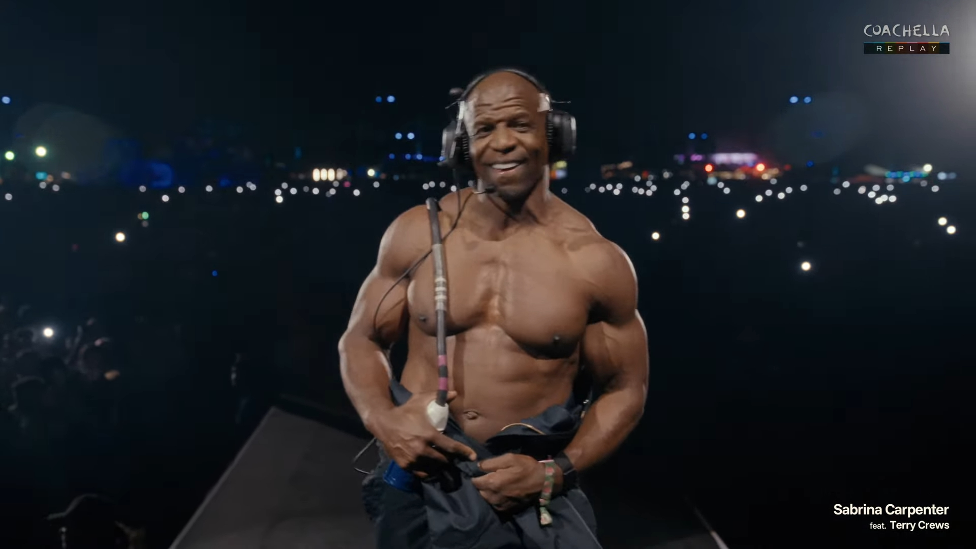 Madonna and Sabrina Carpenter performing together on stage, holding microphones.