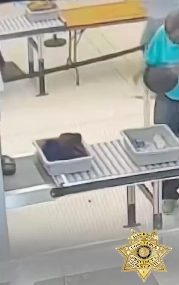 Surveillance footage showing Earl Gerald dropping a bag of cannabis on the floor.