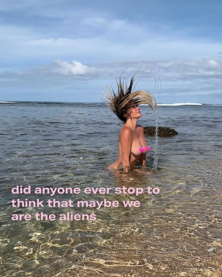 Kesha in the ocean, her hair flipped back and water splashing around her, with text on the image.