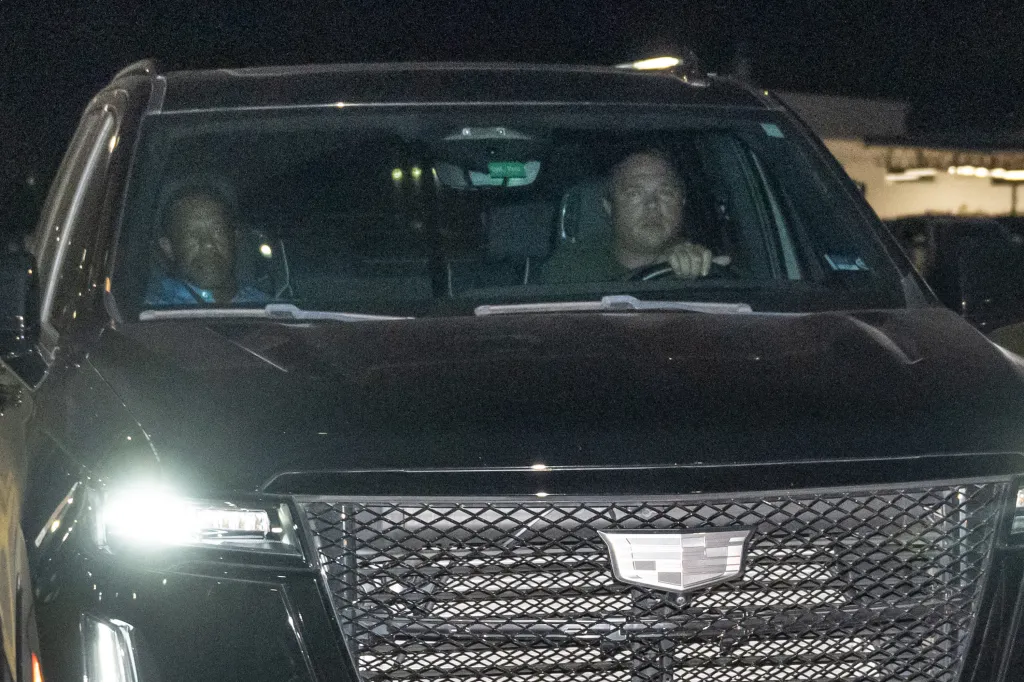 Tiger Woods leaving the Martin County Sheriff’s Office in a black Cadillac SUV.