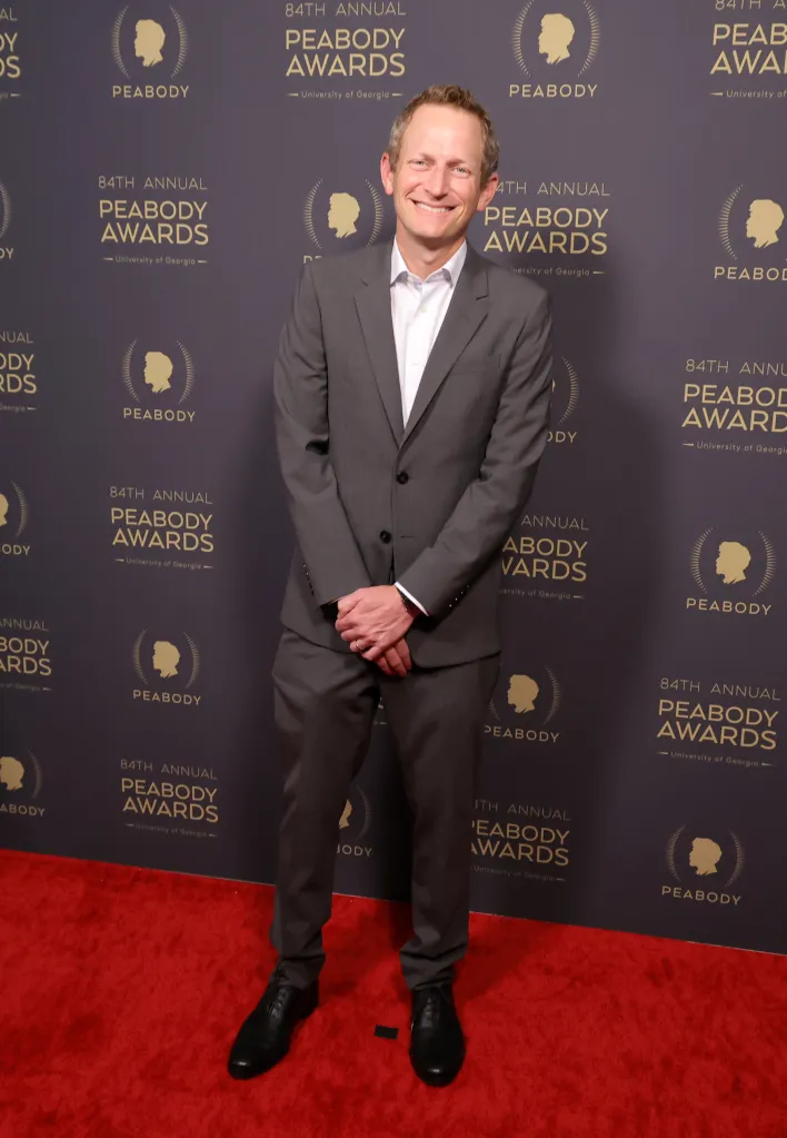 Todd Schulman poses on the red carpet at the 84th Annual Peabody Awards.
