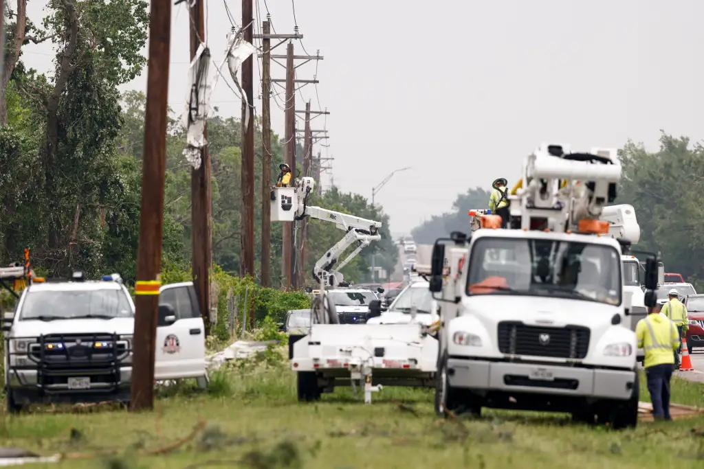 Linemen restore power after severe weather.