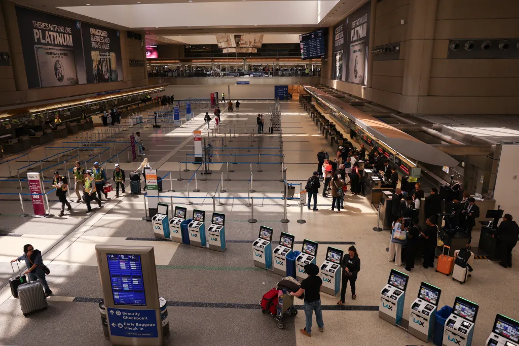 Passengers check-in and check bags at the Tom Bradley International Terminal (TBIT) at Los Angeles International Airport (LAX).