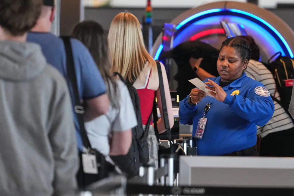 A TSA worker checks passengers at Greater Pittsburgh International Airport on March 26, 2026.