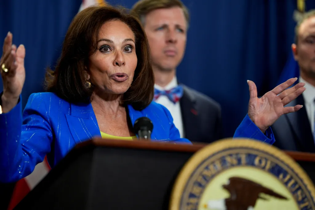 U.S. Attorney for D.C. Jeanine Pirro gestures while speaking about Elias Rodriguez.