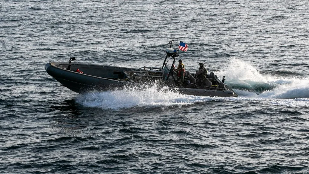 U.S. forces patrol the Arabian Sea near M/V Touska in a Rigid Hull Inflatable Boat.