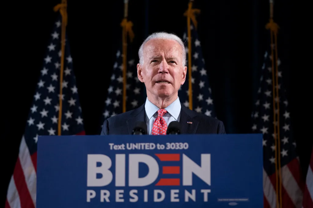 Joe Biden delivering remarks about the coronavirus outbreak from a podium with American flags behind him.