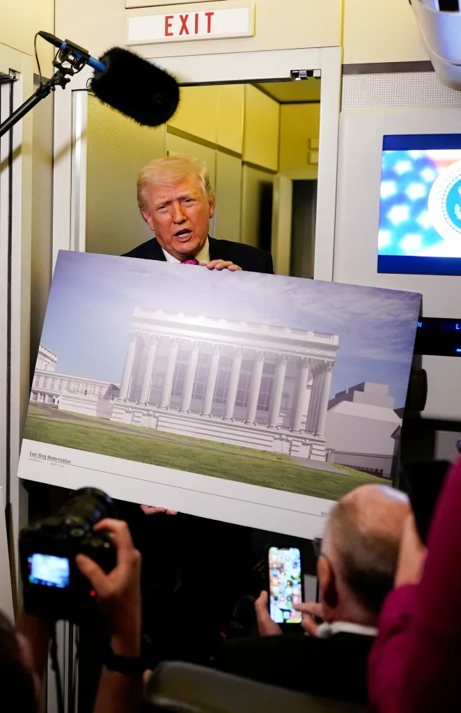 President Donald Trump holding up a rendering of the planned White House ballroom while onboard Air Force One.