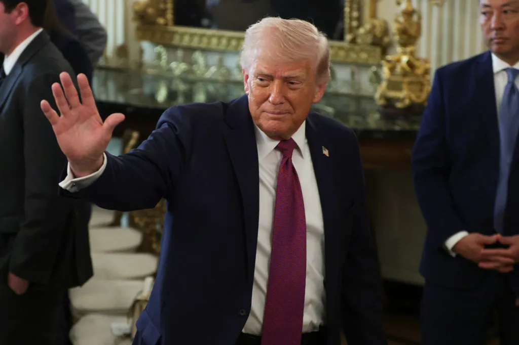 President Trump waves to the crowd at the NCAA Collegiate National Champions Day event.