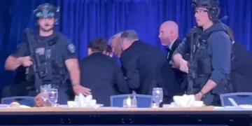Photos capture guns drawn and guests diving under tables as pandemonium grips WHCD