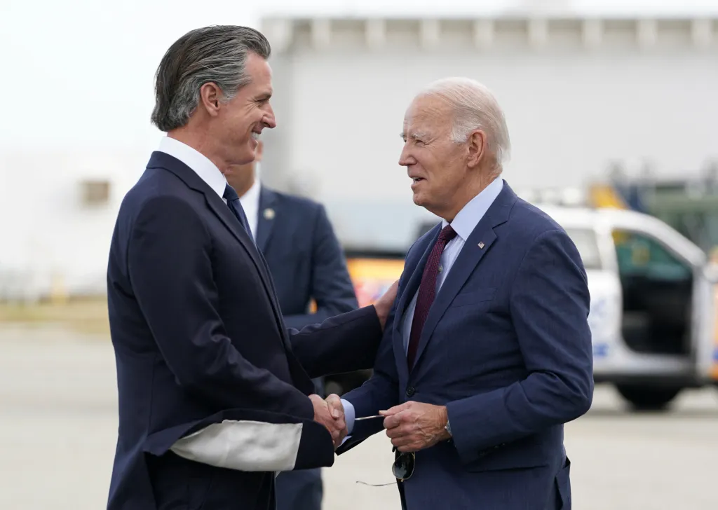 President Joe Biden shaking hands with California Governor Gavin Newsom.
