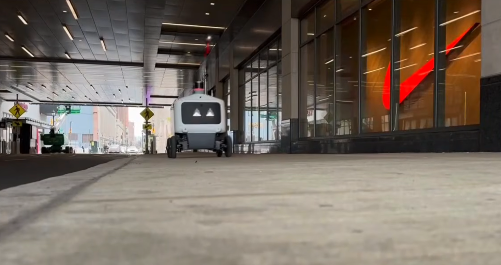 An Uber Eats delivery robot on a city sidewalk in Philadelphia.