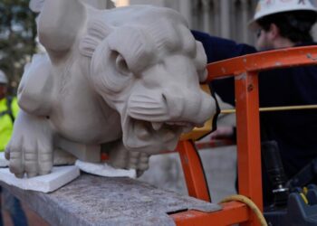 Final gargoyle returned to its perch atop rehabbed Kentucky cathedral modeled after Notre Dame