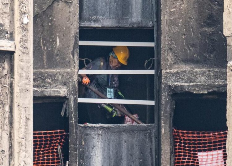 Grieving, traumatized survivors return to their homes 5 months after deadly Hong Kong fire