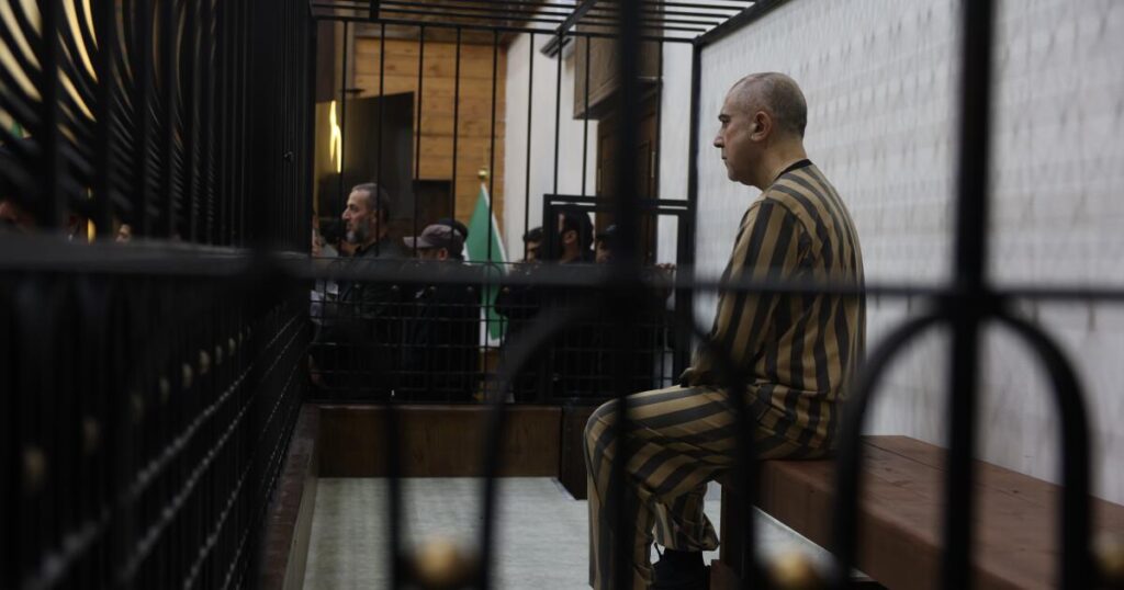 Syria’s first public trial of Assad-era officials opens in Damascus