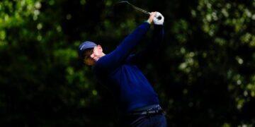 Defending champ Rory McIlroy excels in tough conditions to share Masters lead