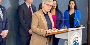 County prosecutor charges ICE agent with assault for pointing gun at people on Minneapolis highway