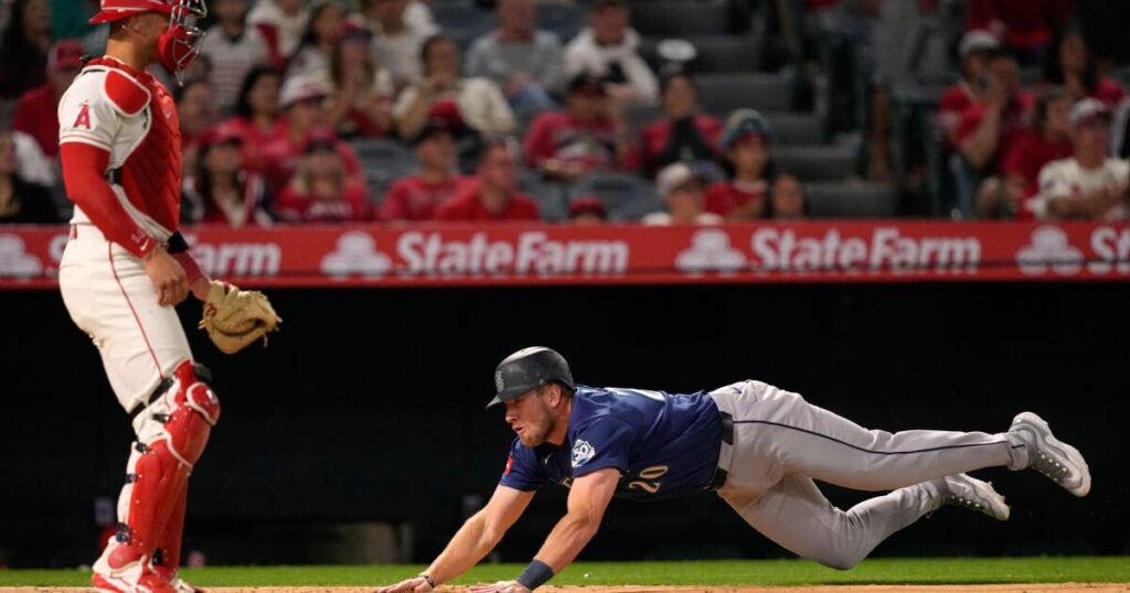 Angels muster only one hit in extra-innings loss to Seattle in home opener