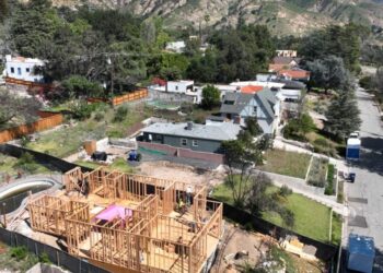 Rebuilding permits in Altadena have picked up, but construction lags and financial woes loom