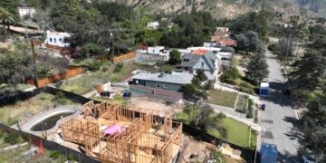 Rebuilding permits in Altadena have picked up, but construction lags and financial woes loom