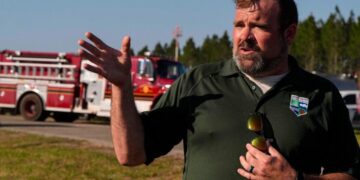 Southern U.S. wildfires force residents to flee, leaving them unsure if their homes are standing